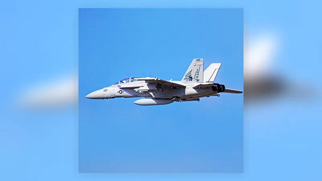 FMS 70mm F-18F EDF jet flying against a blue sky