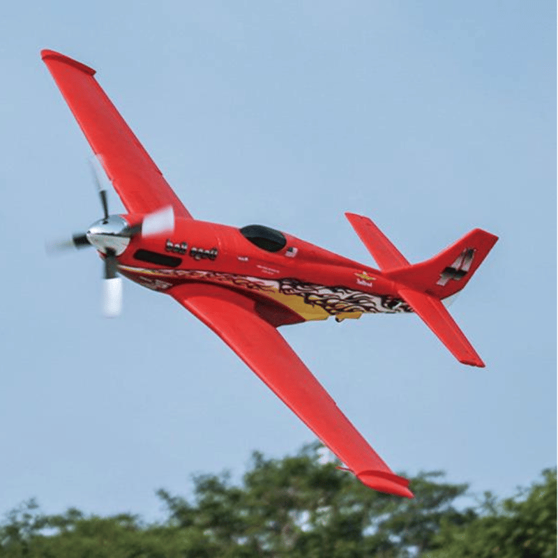 Red FMS 1100mm P-51 Mustang V2 PNP remote control airplane with flame graphics in flight.