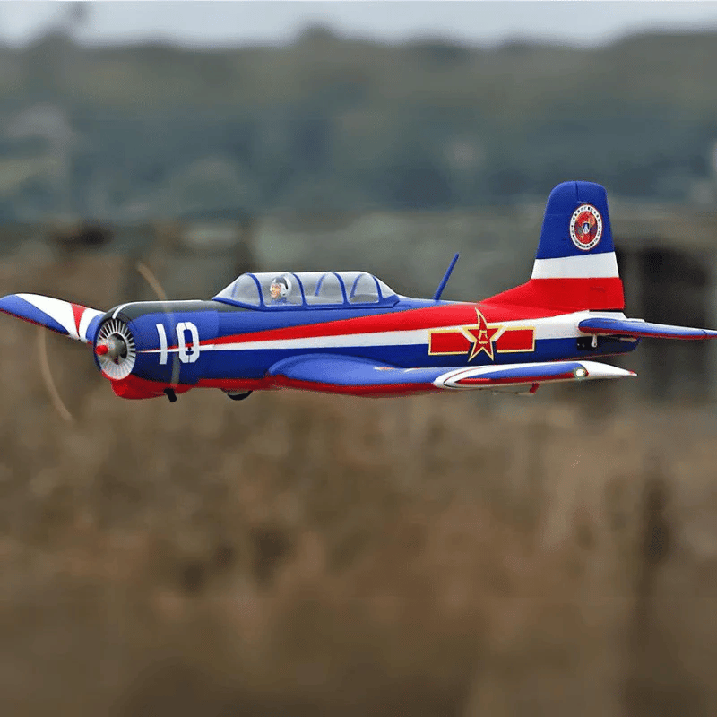 FMS 1200mm CJ-6 V2 PNP airplane, blue, red, white livery with '10' and star emblem, in flight