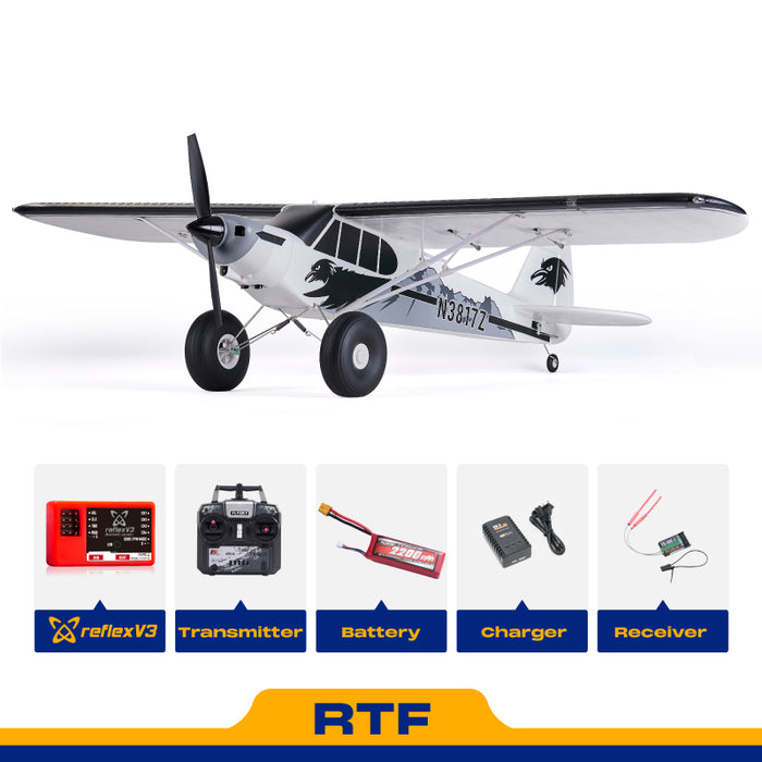 FMS 1300mm PA-18 Super Cub RTF RC airplane with Reflex V3, transmitter, battery, charger, and receiver shown.