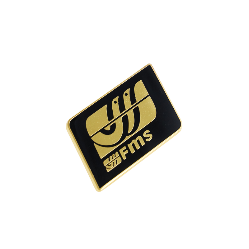 FMS logo gold hard enamel pin on black background