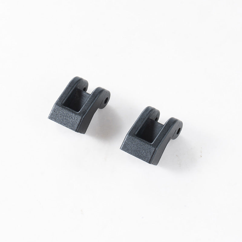 Two black plastic 1:10 Canyon Panhard mounts with mounting holes.