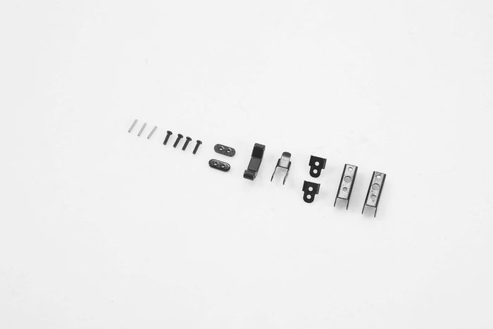 Black hardware parts for RC vehicles including screws, clips, and locks.