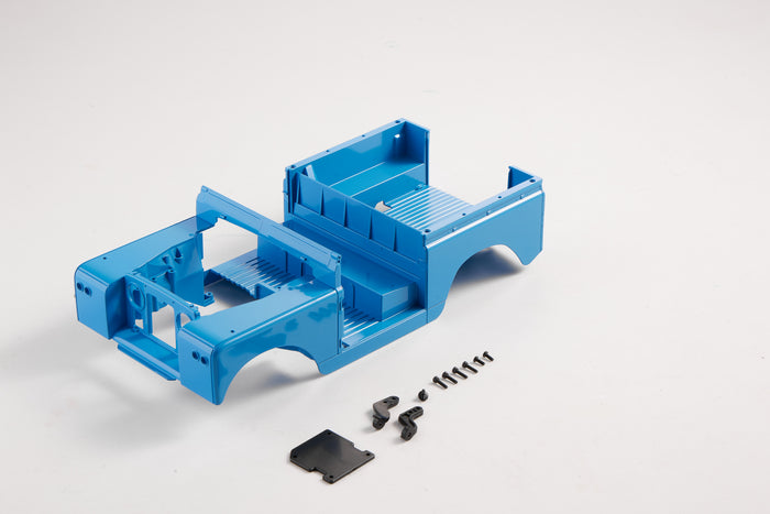 Blue painted 1:12 Land Rover car body with screws and parts.