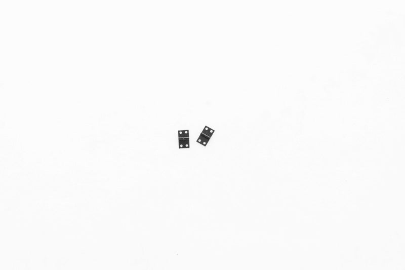 Miniature black hinges for 1:24 Unimog 421 model kit.