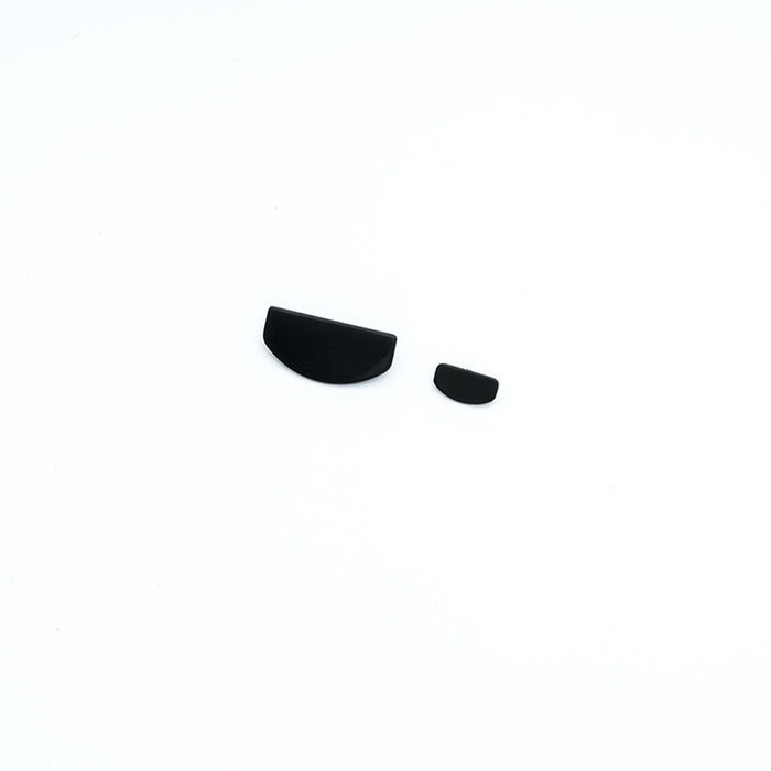 Black plastic half-moon shaped RC model parts for repairs