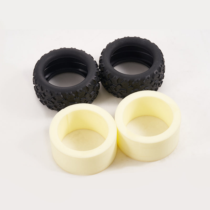 FMT10 Colorado tires: pair of knobby RC tires with yellow foam inserts.