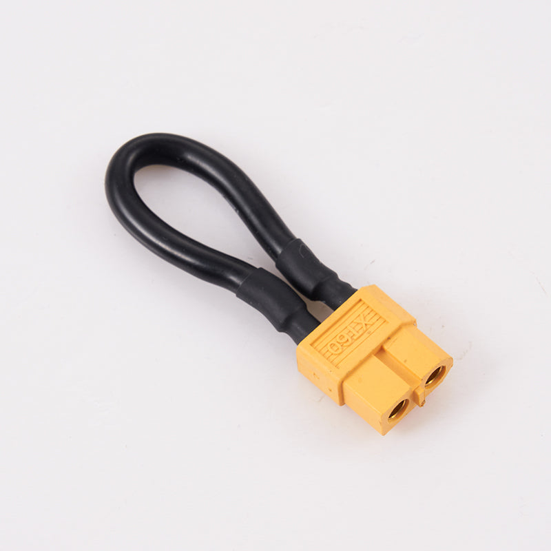Yellow XT60 connector plug with black wires, serving as a jumper.