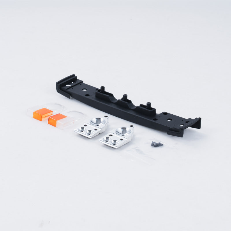 FCX10 Range Rover front light set components: black bracket, silver mounts, orange lenses.