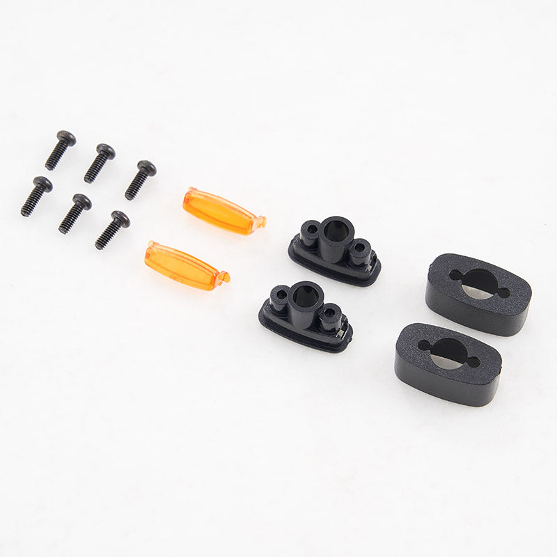 FCX10 Range Rover side light set: orange light covers, black mounting bases, screws.