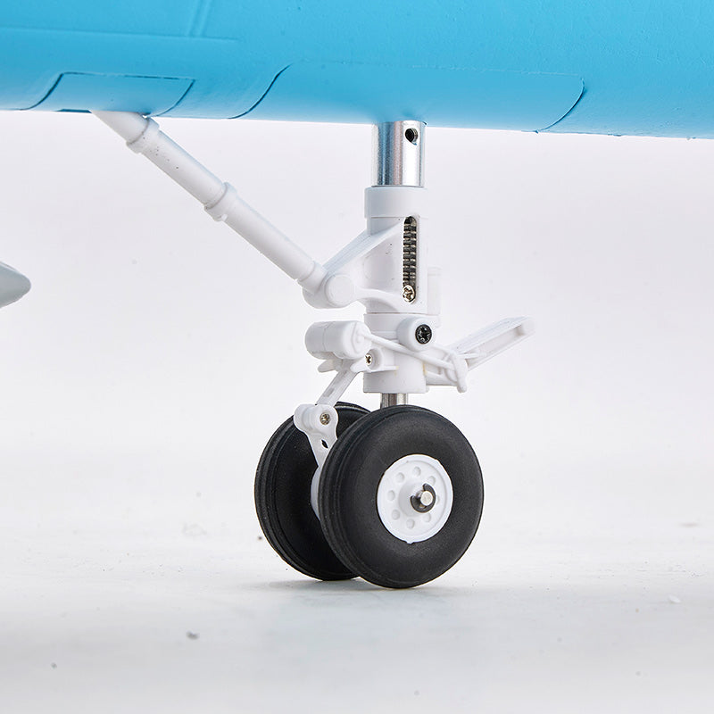 FMS F/A-18 Hornet jet PNP: close-up of the white landing gear with dual black wheels and silver struts.