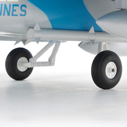 FMS 64mm F/A-18 Hornet RC jet landing gear with black wheels and white hubs, showing detailed struts and blue/white livery.