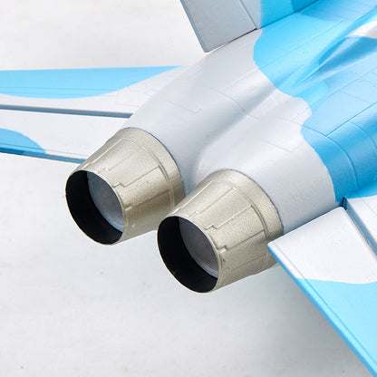 Close-up of twin exhaust nozzles on a blue and white FMS F/A-18 Hornet EDF jet model.