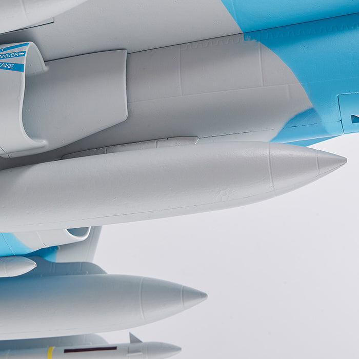 FMS EDF Jet 64mm F/A-18 Hornet PNP with external fuel tanks and missiles on grey fuselage with blue markings.