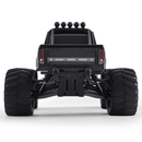 FMS 1:10 Ford F100 Monster Truck rear view, black, large tires, silver 'FORD' lettering