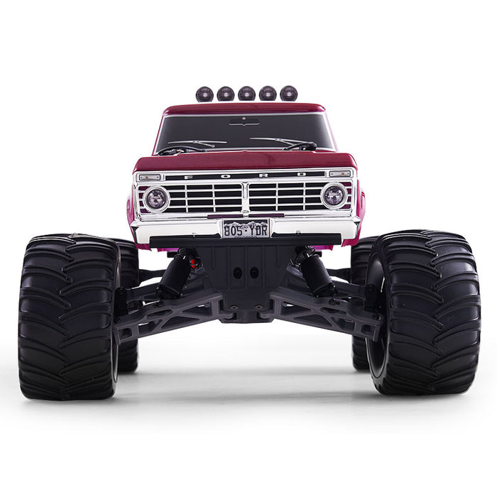 FMS 1:10 Ford F100 Monster Truck, red, with large black tires, visible grille and headlights, on a white background.