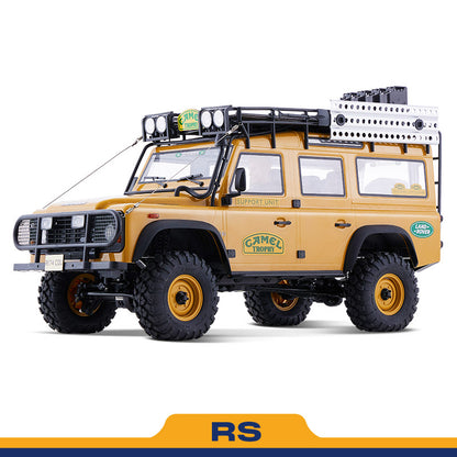FMS 1:10 scale RC Defender Camel Trophy Edition RS, yellow, with roof rack and off-road tires.