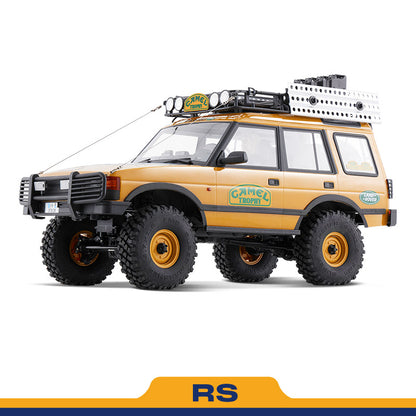FMS 1:10 FCX10 Land Rover Camel Trophy RS model: yellow SUV with roof rack and off-road tires.