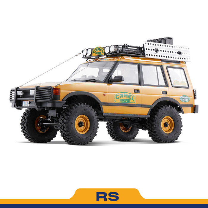 FMS 1:10 FCX10 Land Rover Camel Trophy RS model: yellow SUV with roof rack and off-road tires.