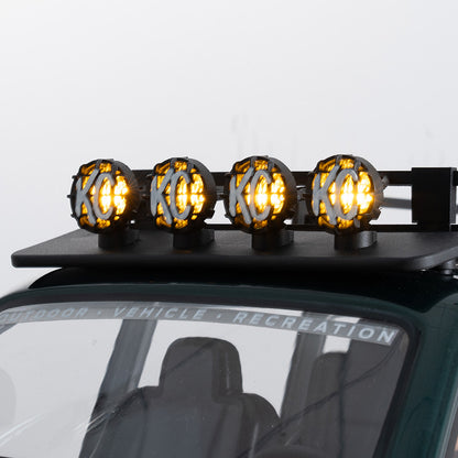 Illuminated KC logo off-road lights on FMS 1:10 LC80 RC roof rack