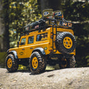 FMS 1:24 FCX24M Land Rover Camel Trophy yellow RC crawler with roof rack and spare tire