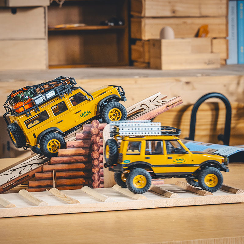 FMS 1:24 FCX24M Land Rover Camel Trophy Edition RTR on a wooden ramp