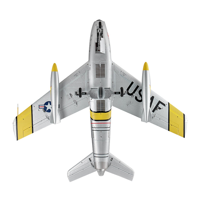 Silver FMS 80mm EDF Jet F-86 Sabre PNP RC airplane with yellow accents and USAF markings, featuring retractable landing gear.