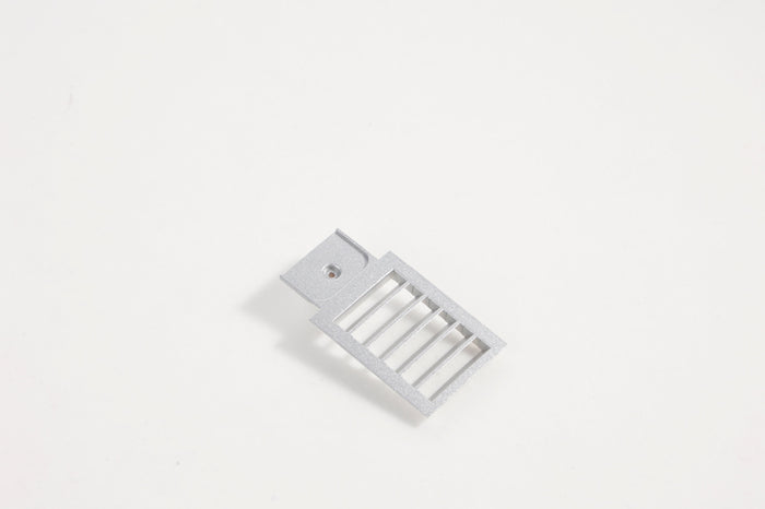 Gray air grill accessory for RC airplane fuselage.