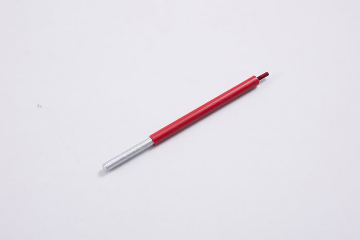 Red pen with silver tip on a plain white background