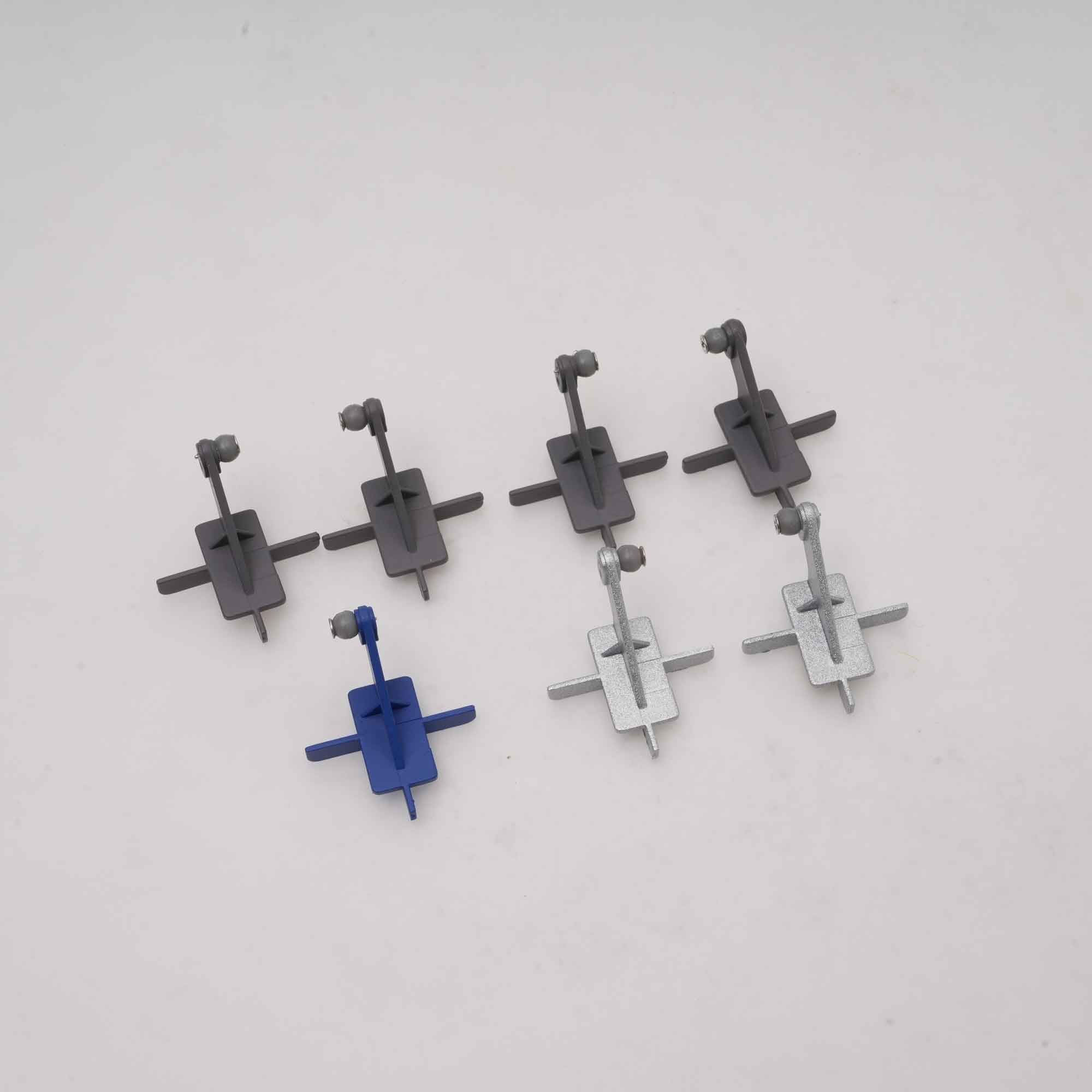 Four integral control horns in red, gray, and blue for remote control models