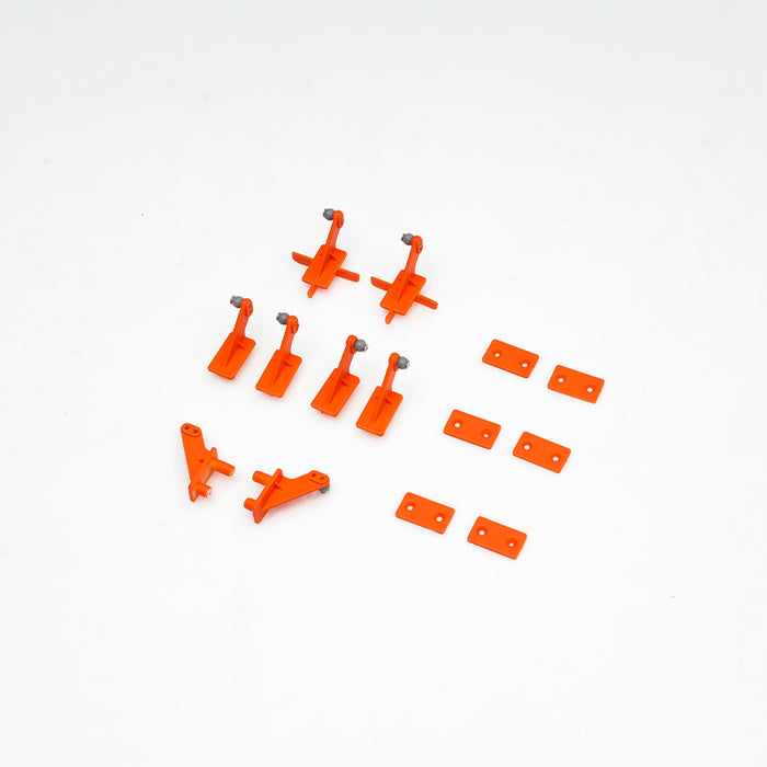 Orange control horns and brackets for RC model airplane accessories