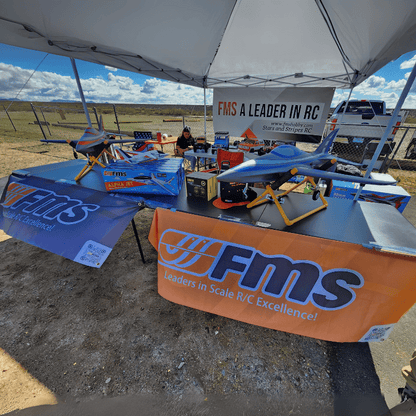 FMS RC models displayed with tent, slogan, and engaging product showcase