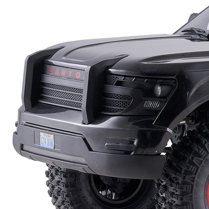 FMS 1:10 Canyon RS front grille with red CANYON lettering and black honeycomb detail. Nevada license plate '674-XYM'.