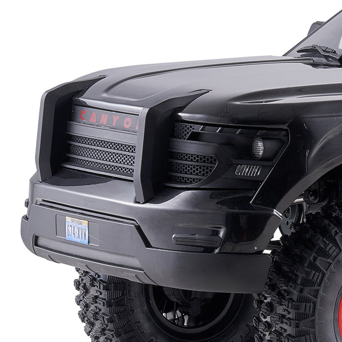 FMS 1:10 Canyon RS front grille with red CANYON lettering and black honeycomb detail. Nevada license plate '674-XYM'.
