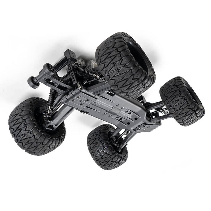 FMS 1:24 Chevrolet Colorado monster truck chassis with large off-road tires.