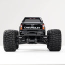 Black FMS 1:24 FMT24 Chevrolet Colorado monster truck rear view with large tires and suspension