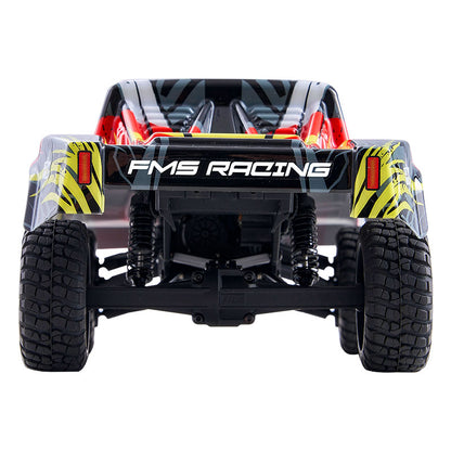 FMS 1:24 Chaser short course truck rear view, with FMS RACING logo.