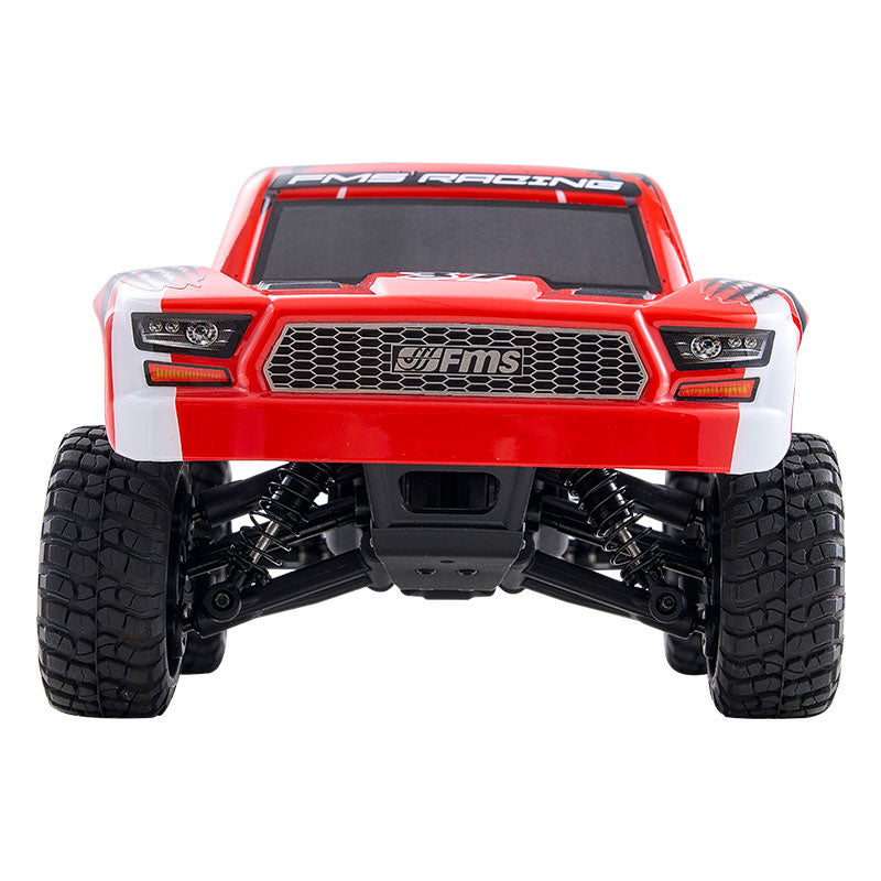 FMS 1:24 FSC24 Chaser short course truck in red and white with FMS Racing branding.