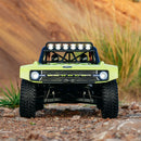 FMS 1:7 Ford Bronco RTR EB with bright green body, black roll cage with lights, and aggressive off-road tires.
