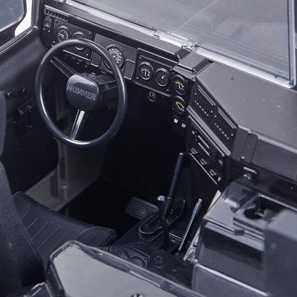 FMS 1:12 Hummer H1 Alpha RTR interior with detailed dashboard, steering wheel, and shifter.