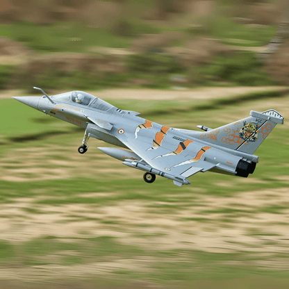 FMS 64mm Rafale EDF jet airborne with vibrant NATO Tiger Meet color scheme