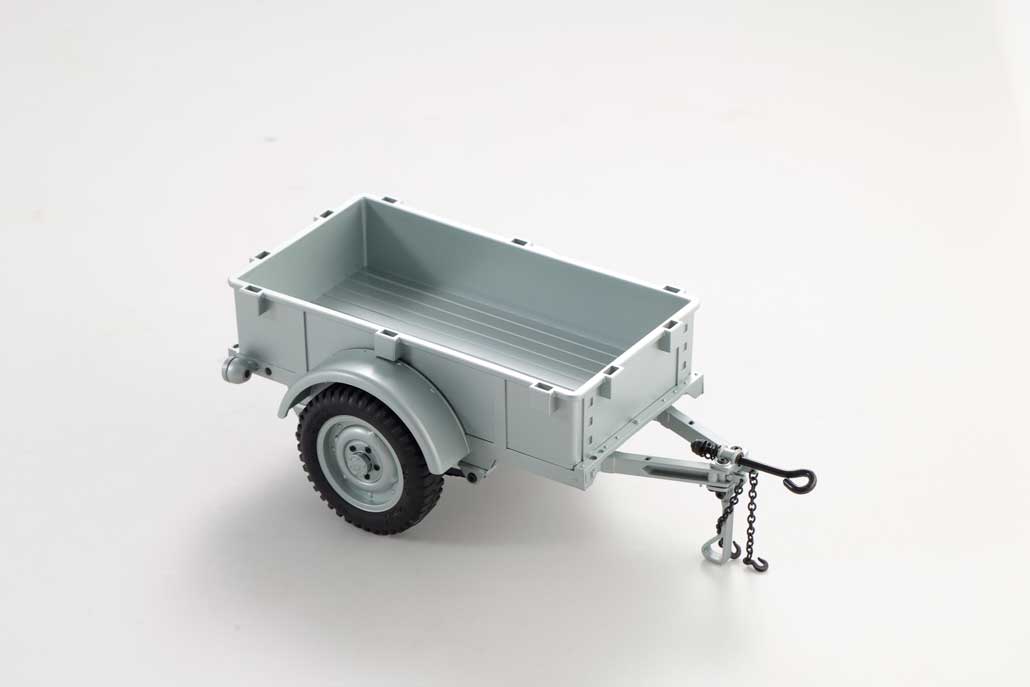 1:18 scale utility trailer model in gray with detailed wheels and hitch.