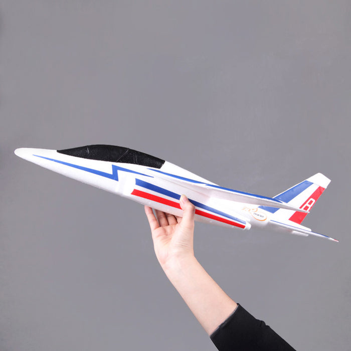 FMS Alpha Hand-Launched Jet Kit held in hand, featuring a sleek foam design.