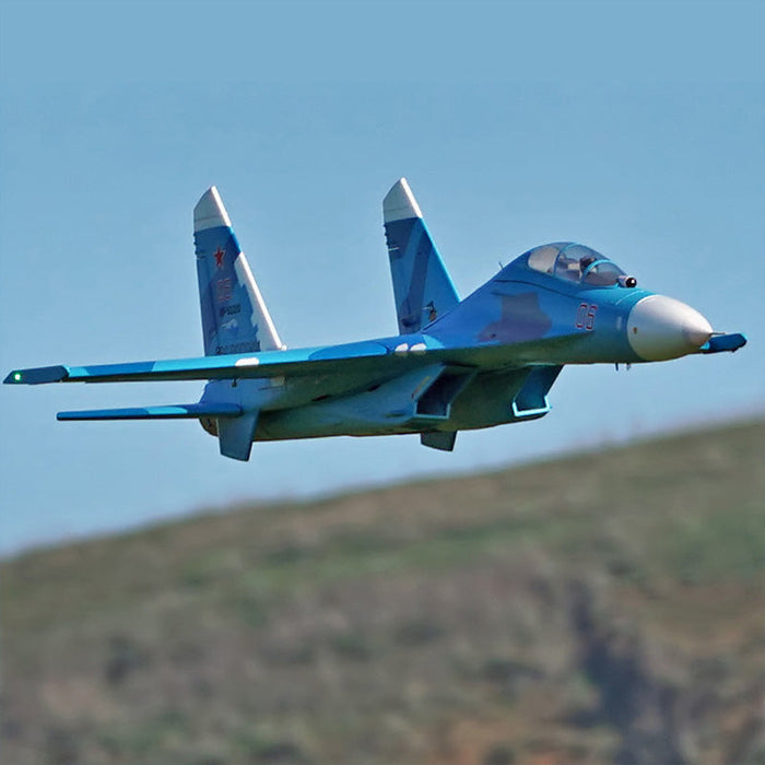 FMS Dual 70mm EDF SU-27 PNP blue camouflage fighter jet in flight.