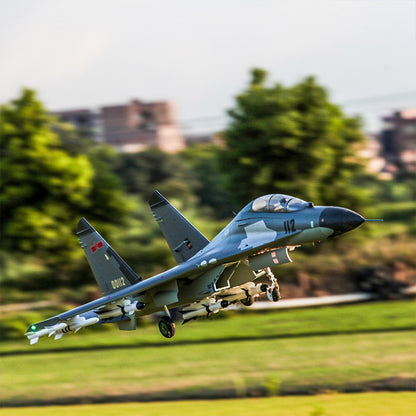 FMS Twin 70mm EDF J-11 PNP jet in flight with detailed camouflage, missile pods, and retracting landing gear.