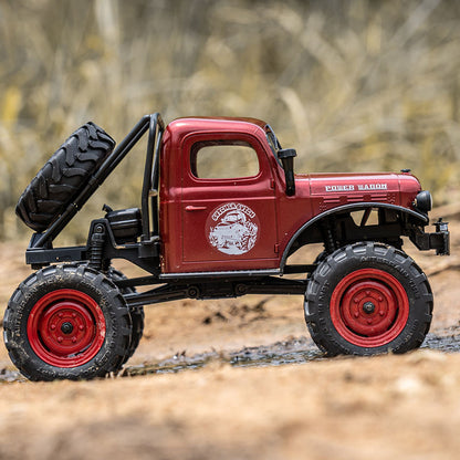 FMS 1:24 FCX24 Power Wagon RTR red remote control rock crawler with spare tire and 'POWER WAGON' text.