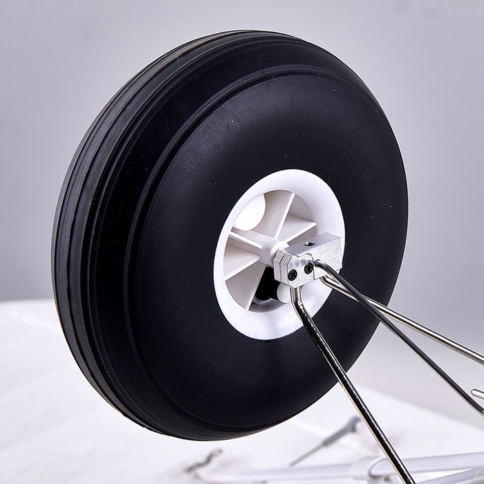 FMS 1300mm PA-18 Super Cub oversized pneumatic rubber tire with metal axle mount.