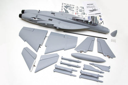 FMS 70mm F-18F V2 PNP model jet kit components, including fuselage, wings, tail fins, and missiles, with decals and manual.