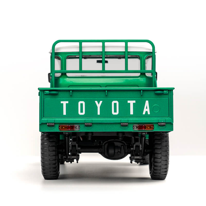 FMS 1:12 scale green Toyota FJ45 pickup truck, rear view showing tailgate with TOYOTA lettering.