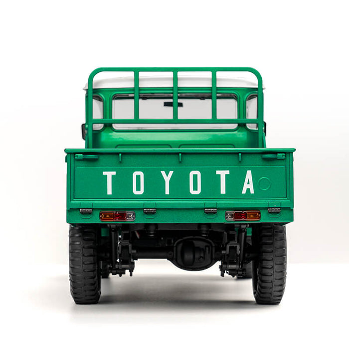 FMS 1:12 scale green Toyota FJ45 pickup truck, rear view showing tailgate with TOYOTA lettering.